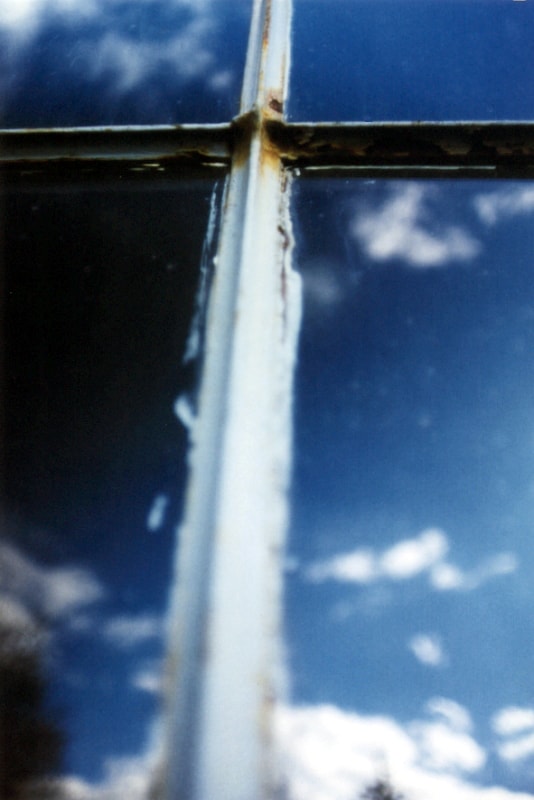 Cross on the Window — photography by Jay Keenan